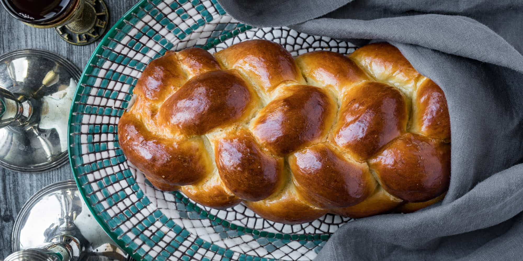 Light, fluffy, perfectly chewy challah recipe from Potluckiest.com